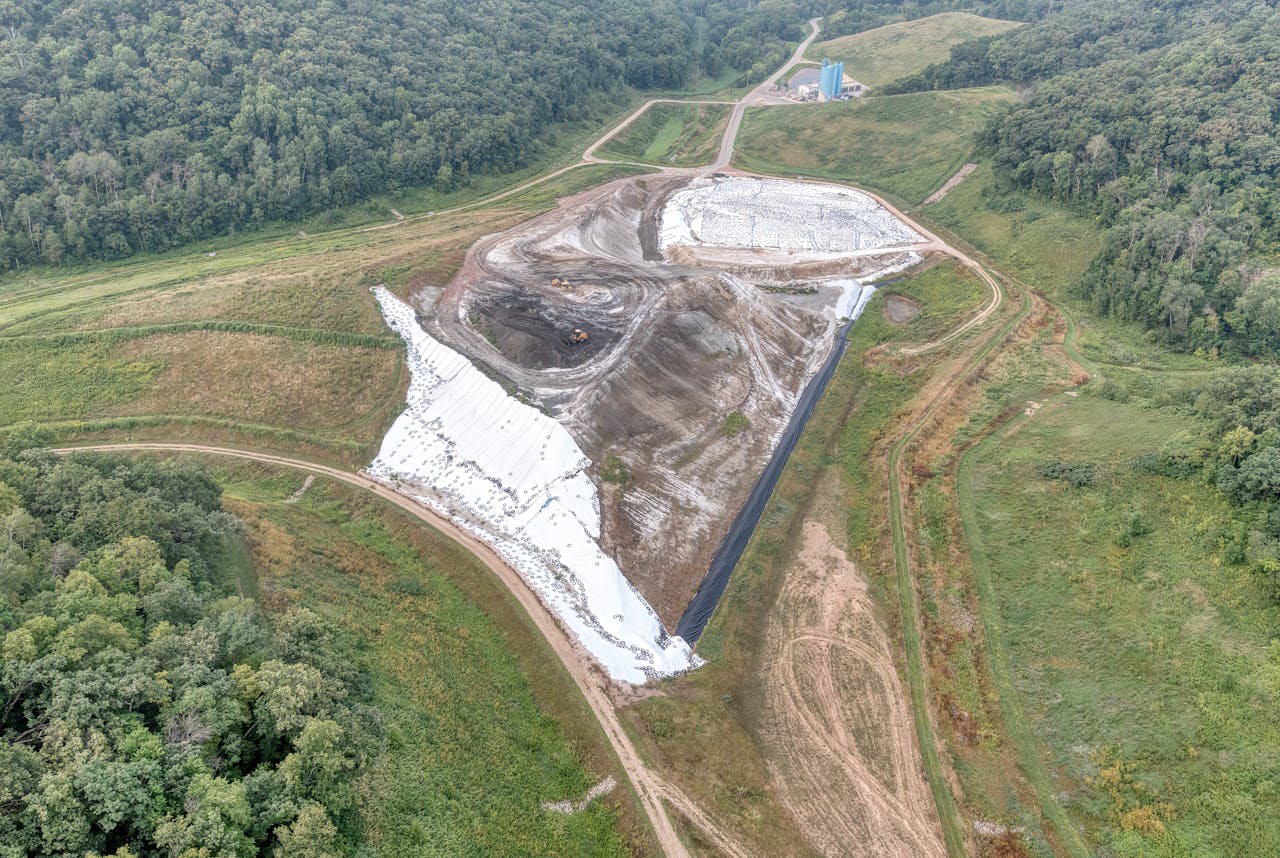 services-06 Aerial view of a construction site near Alma, WI, showing landscape and industrial development.