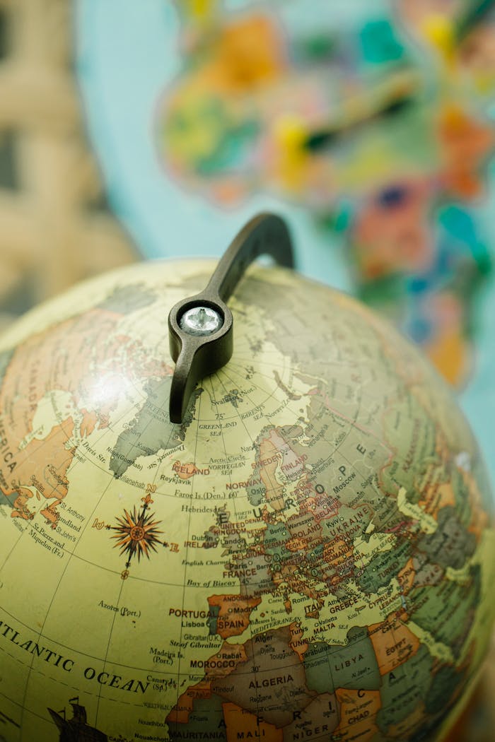 Close-up image of a detailed globe highlighting European countries and geographic features.